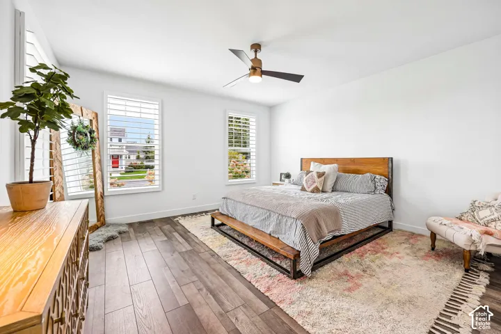 Spacious primary bedroom, and a ceiling fan with integrated lighting