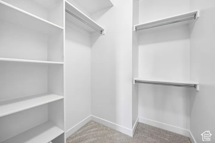 Built-in closet system with shelving and hanging rods