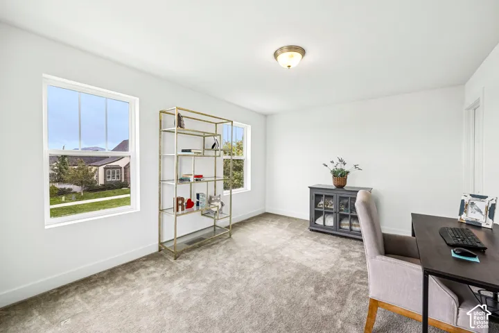 Extra large 2nd bedroom with recessed lighting, light-toned carpeting, and multiple windows provide natural illumination