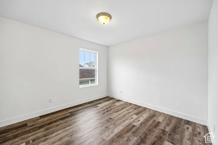 Large 3rd bedroom with laminate flooring.