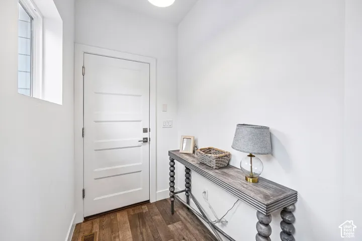 A light and bright entryway leading to/from the garage.