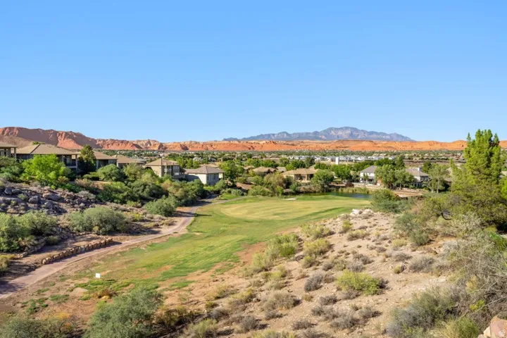 Expansive golf course frontage with red rock mountain backdrop