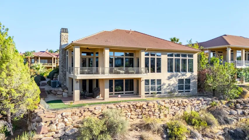 Multi-level stucco exterior with a tile roof