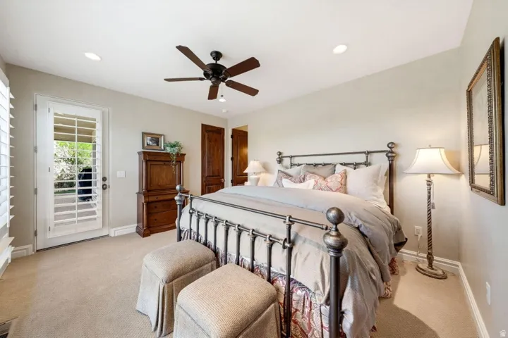 Carpeted flooring with recessed lighting and a ceiling fan