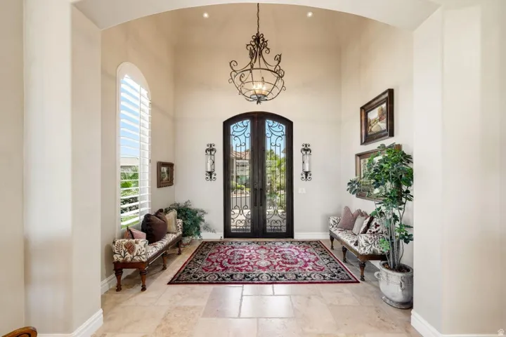 Double arched entry doors with intricate wrought iron detailing