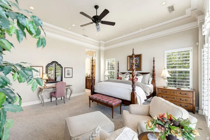 Tray ceiling with recessed lighting and crown molding