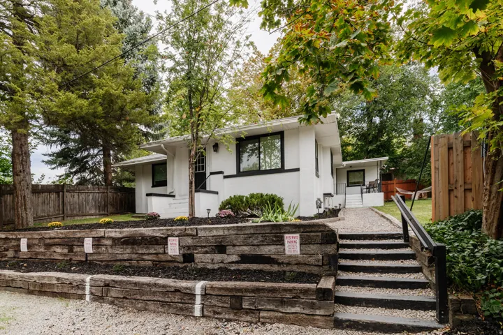 White exterior with black trim windows