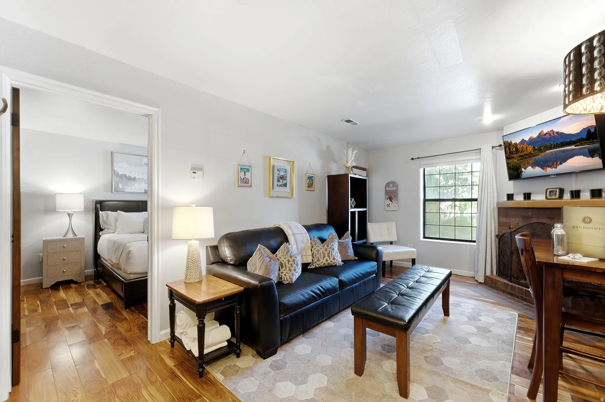 Wood-finish flooring throughout, complemented by light neutral wall tones
