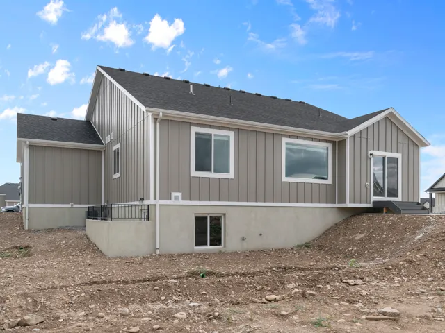 New construction exterior featuring neutral board-and-batten siding