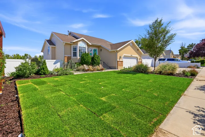 Sodded front lawn with established landscaping