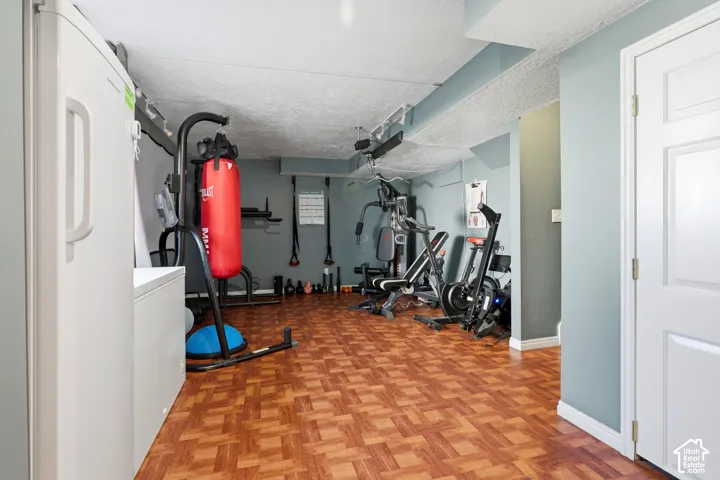 Finished space featuring wood-look flooring and light blue painted walls