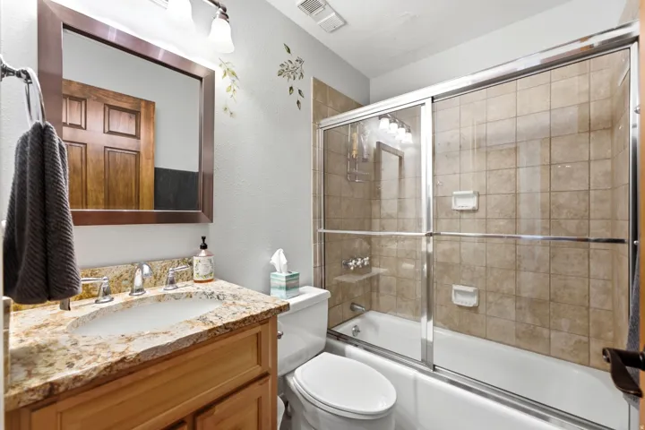 Vanity with stone countertop and integrated sink