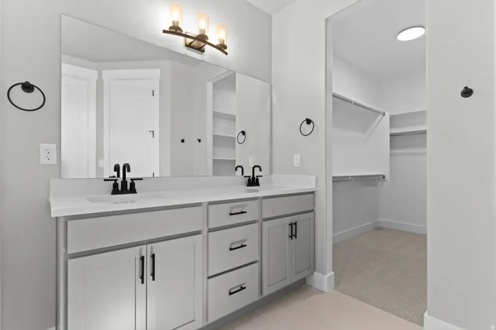 Dual vanity with quartz-finish countertop and undermount sinks