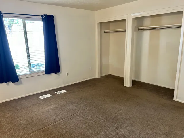 Wall-to-wall carpeting and neutral wall paint