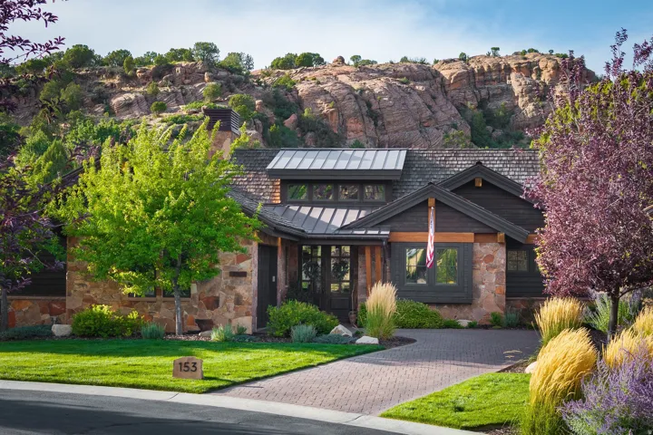 Stone and wood-sided exterior with a metal roof accent