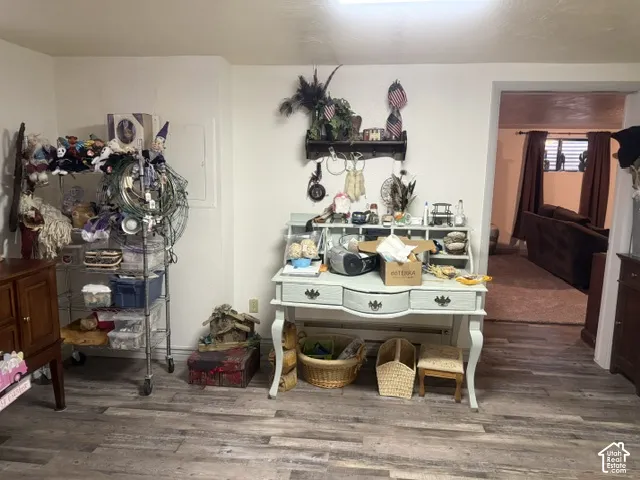 Interior space featuring wood-finish flooring and neutral wall color