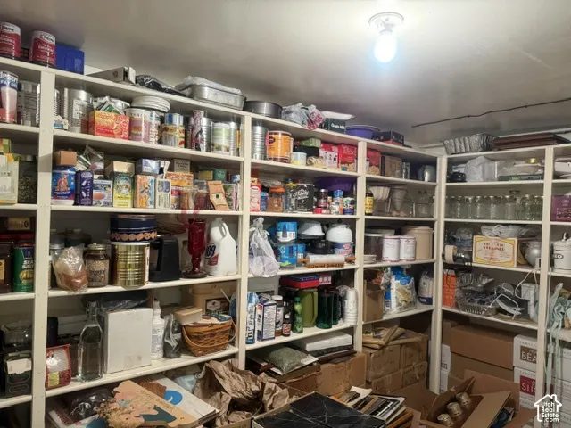 Extensive built-in floor-to-ceiling wooden shelving units providing ample organizational storage