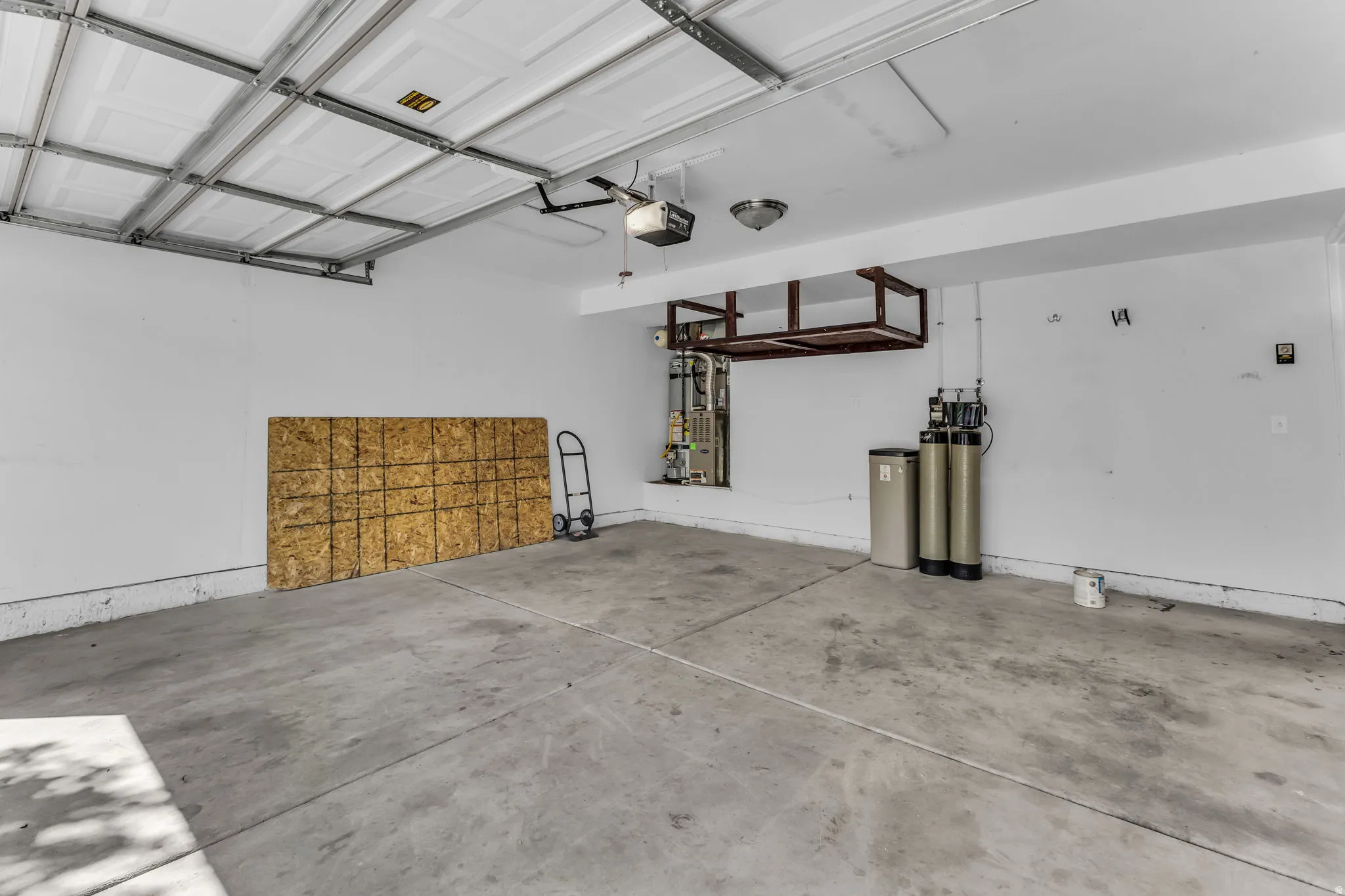 Concrete flooring with overhead garage door mechanism