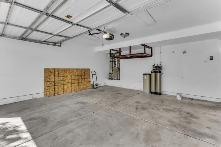 Concrete flooring with overhead garage door mechanism