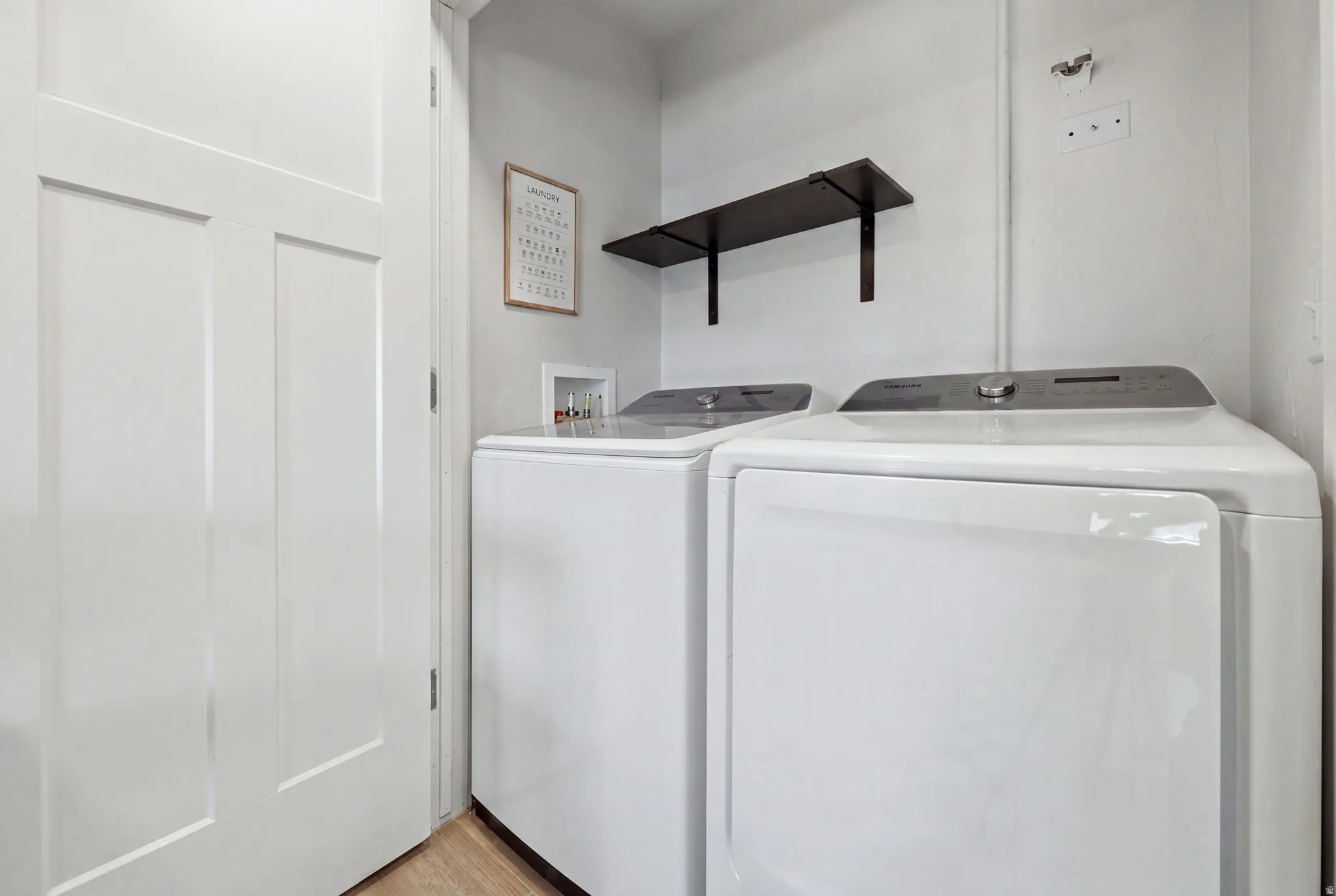Light wood-finish flooring with white walls
