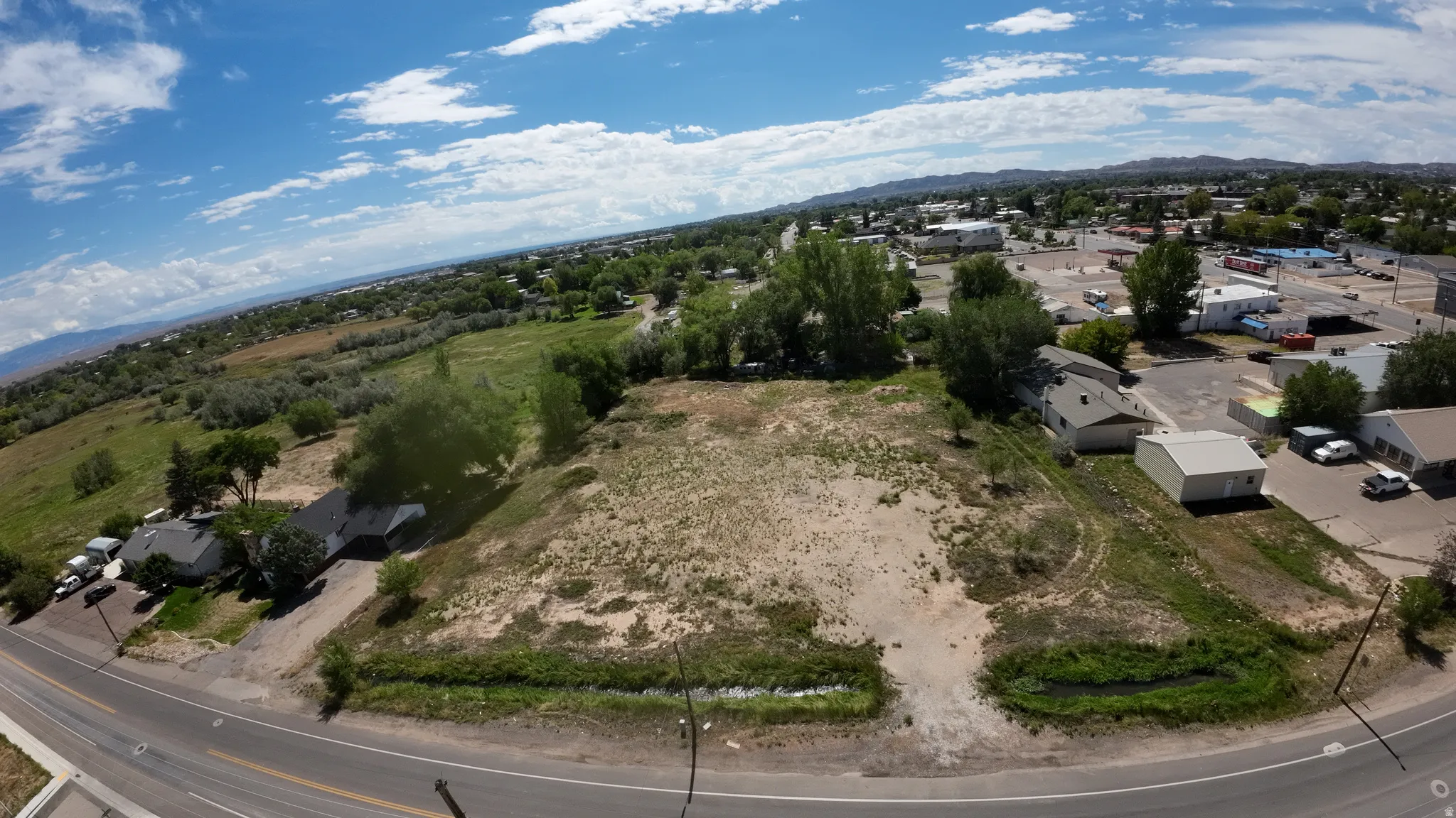 Expansive land parcel featuring open terrain and distant mountain range