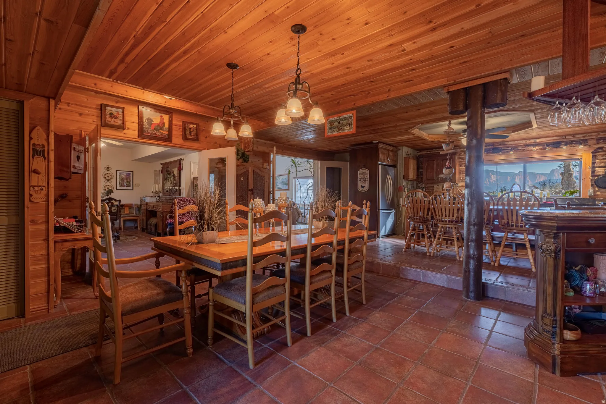 Wood-paneled ceilings, tile flooring, and integrated ceiling lighting