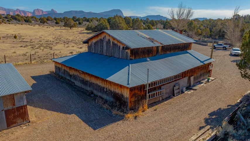 Two-story barn structure with corrugated metal roofing
