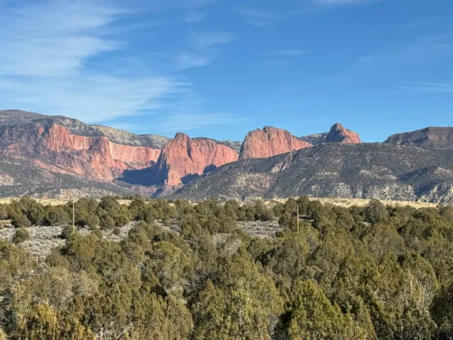 Expansive mountain range backdrop with natural rock formations