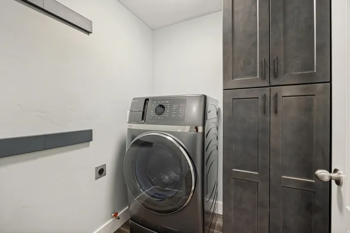 Built-in cabinetry with dark wood-finish doors and matte black hardware