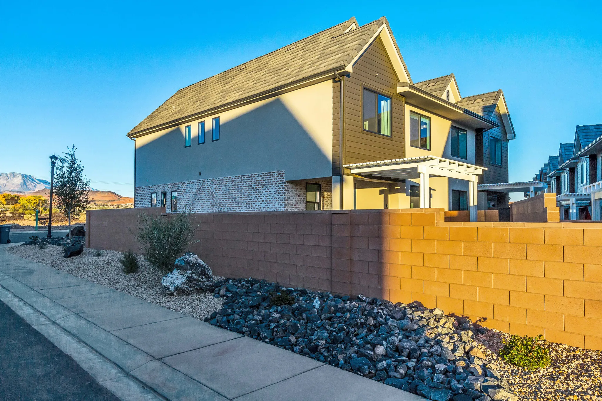Multi-level exterior with stucco and horizontal siding