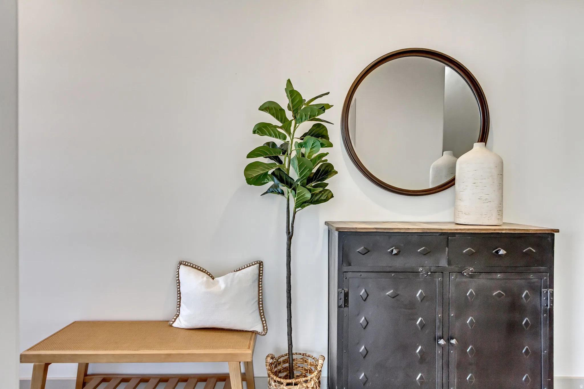 Accent wall with round framed mirror