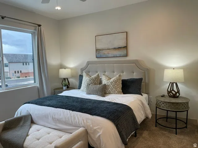 Neutral wall color, carpeted flooring, window with vertical blinds, ceiling fan, and recessed lighting