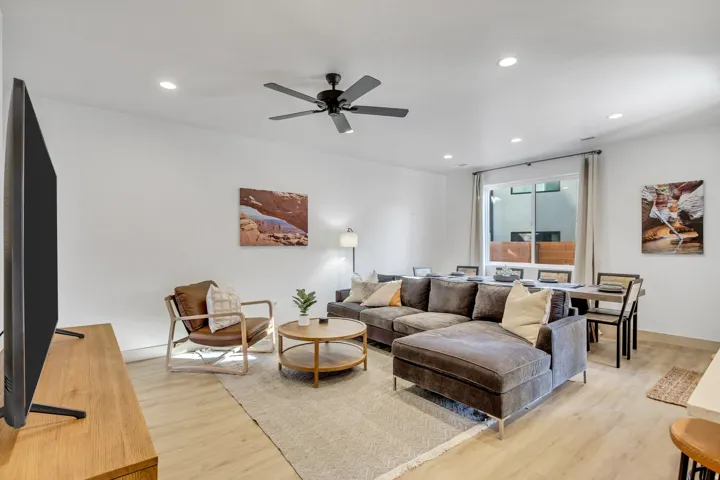 Wood-finish flooring throughout, recessed lighting, and a ceiling fan