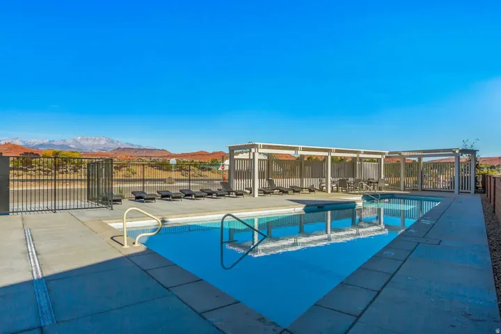 Rectangular swimming pool with integrated steps, surrounded by a concrete deck