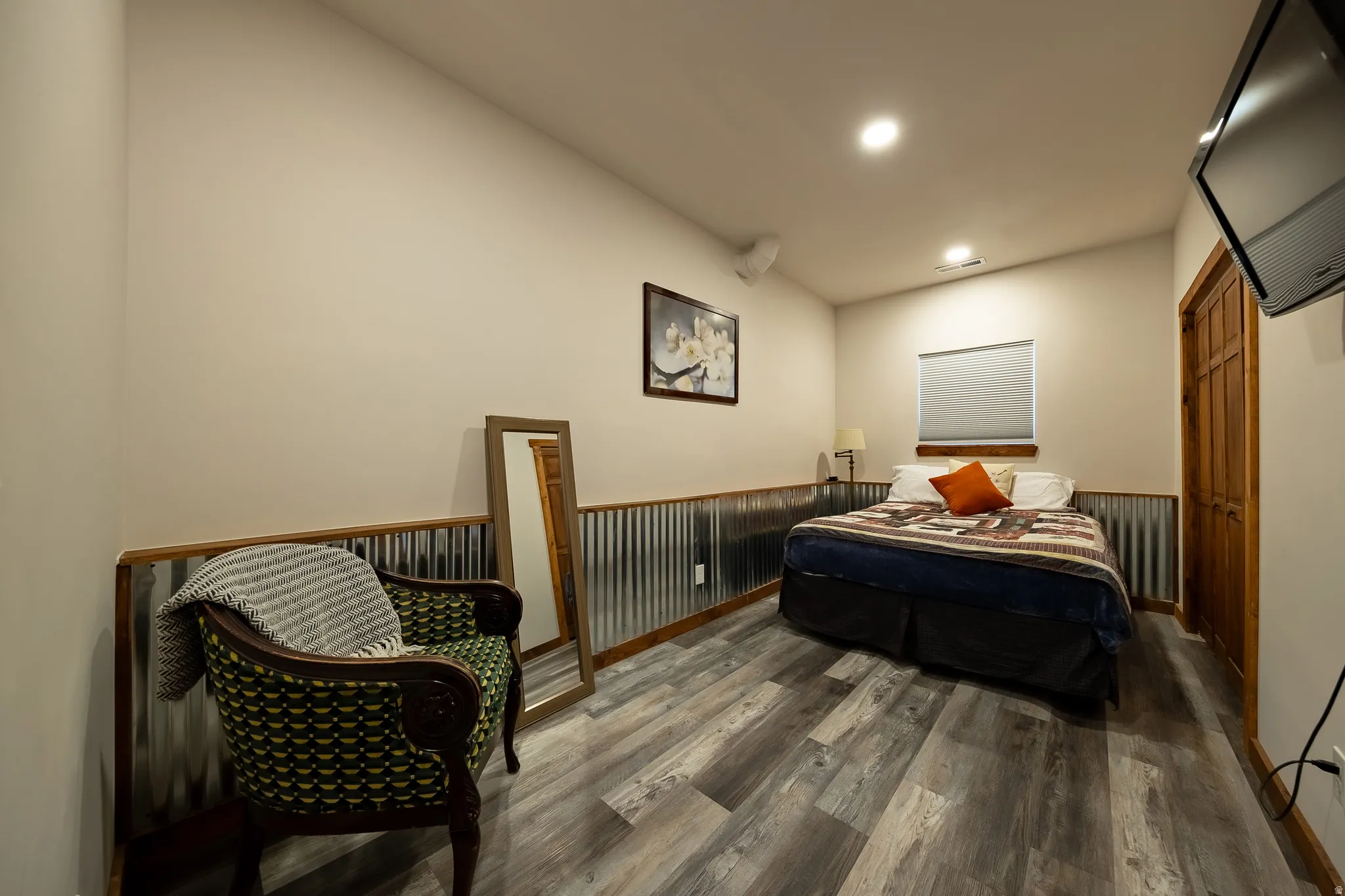 Wood-finish flooring with corrugated wainscoting and wood trim
