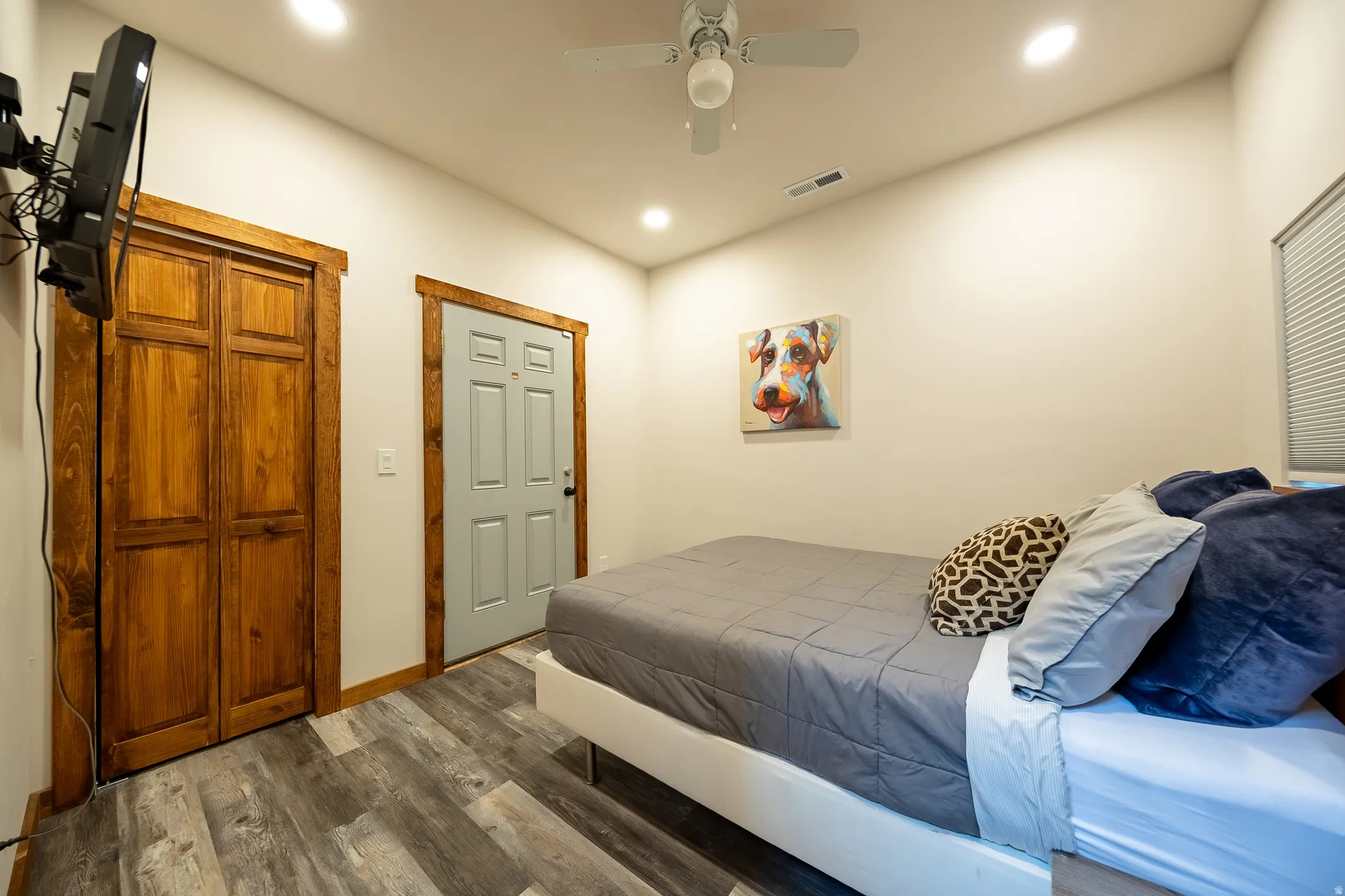 Wood-finish flooring, recessed lighting, and a ceiling fan