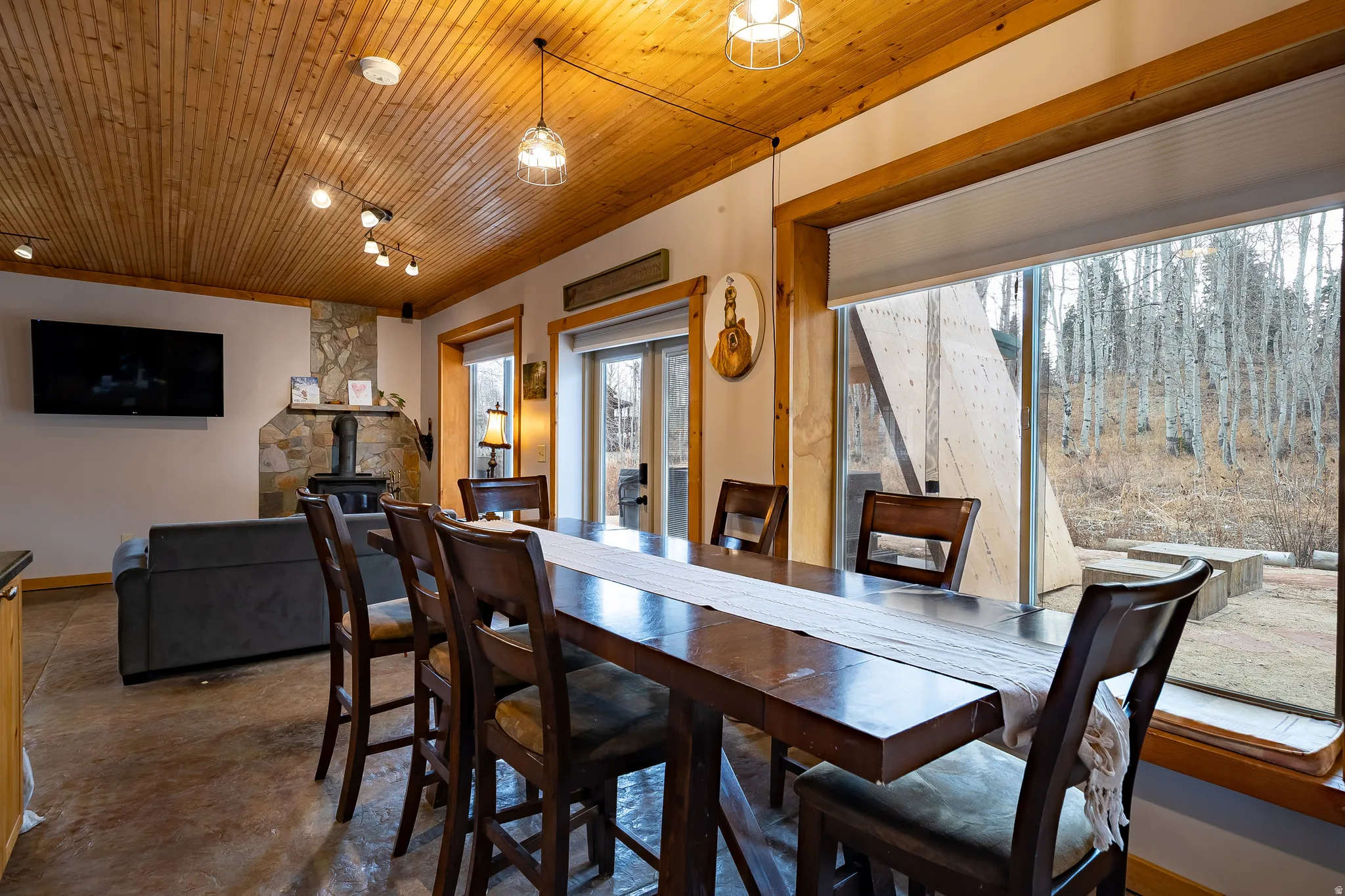 Wood-paneled ceiling with recessed and track lighting
