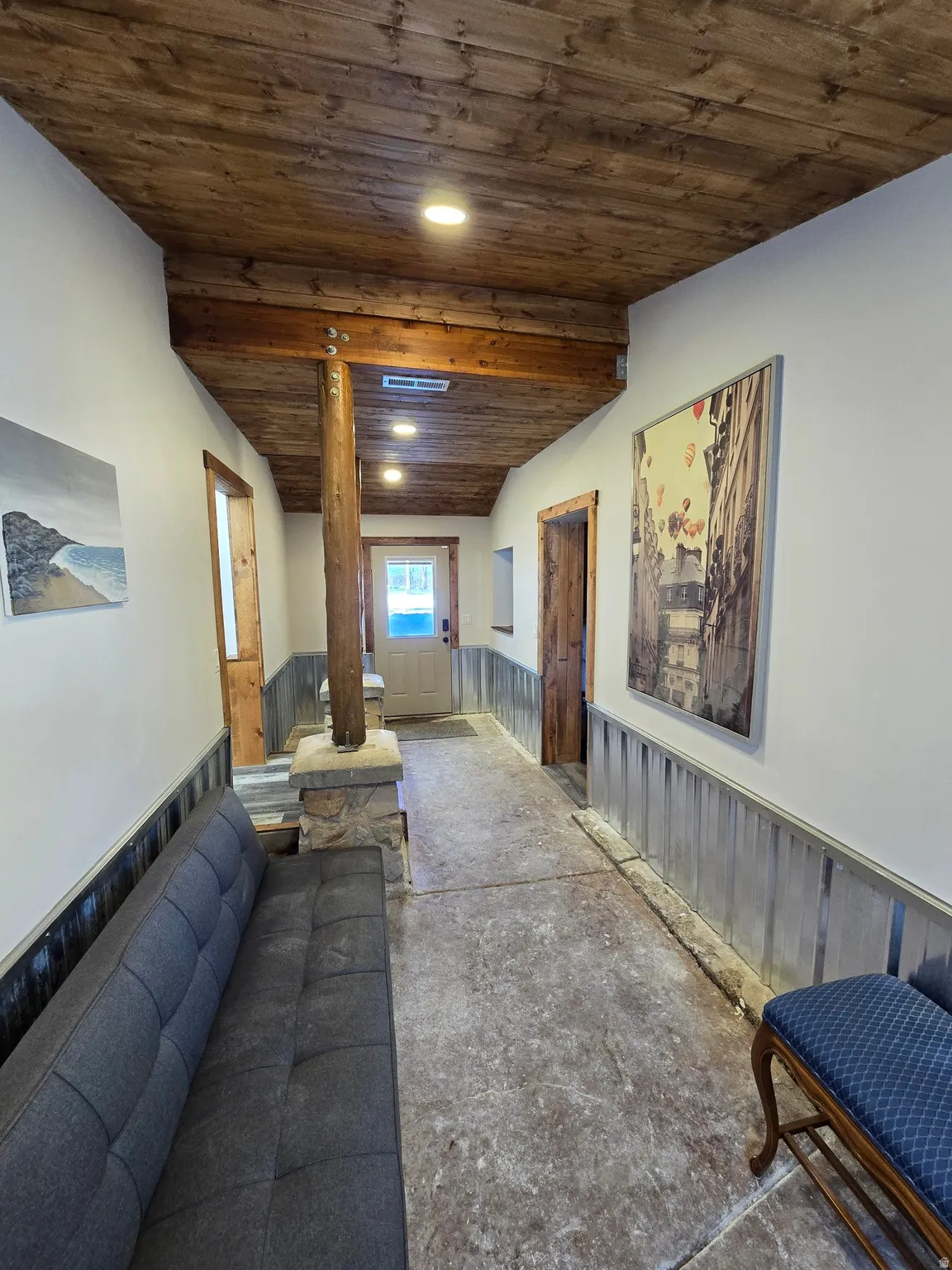 Wood-paneled ceiling with recessed lighting