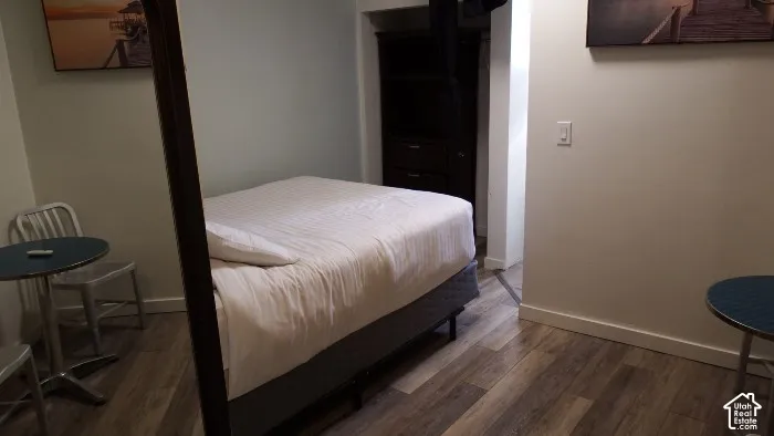Wood-finish flooring throughout the room
