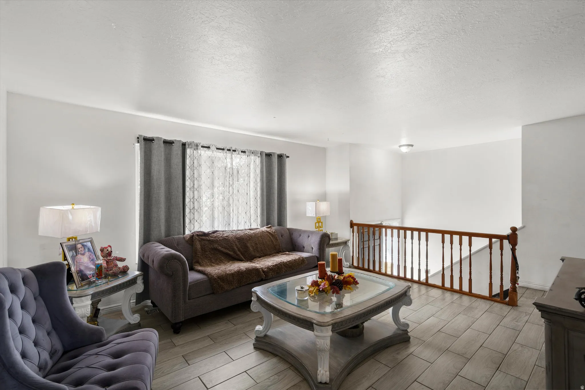 Wood-finish tile flooring throughout the living space