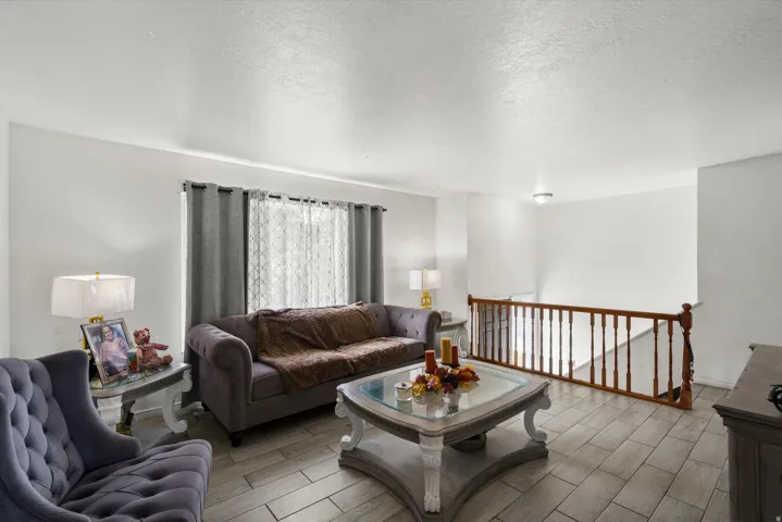 Wood-finish tile flooring throughout the living space