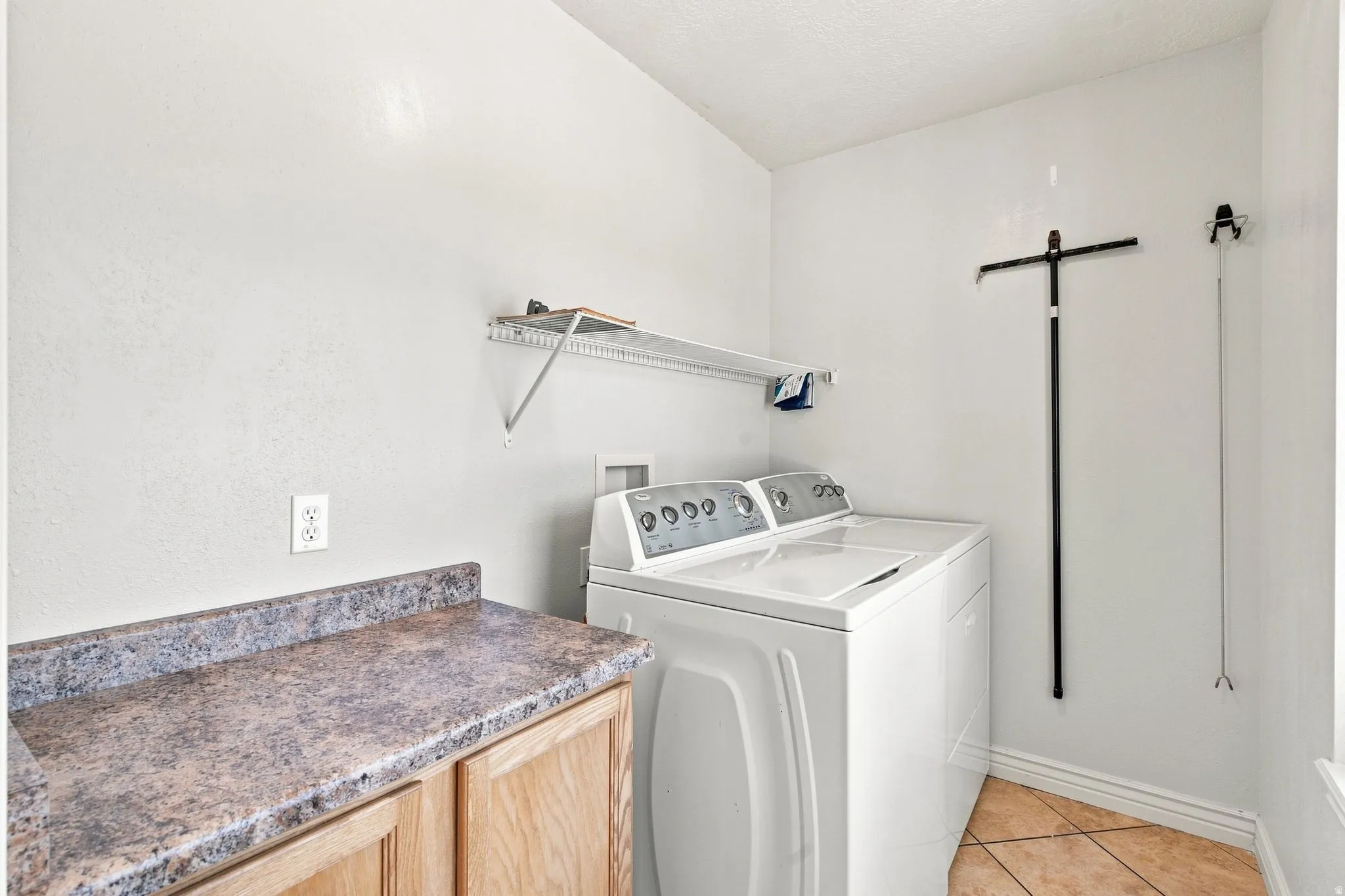 Large Bathroom, washer and dryer included. Long counter top for folding and organization.