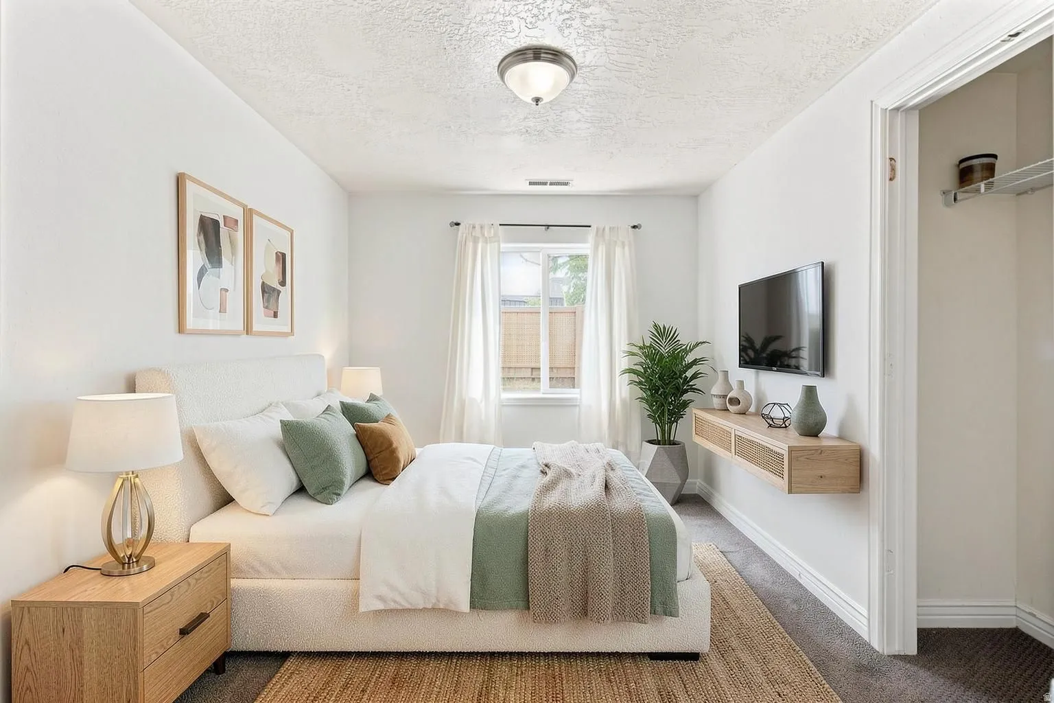 This is one of the two basement apartment bedrooms. This bedroom is behind the stairs to the right of the laundry room. This picture has been virtually staged.