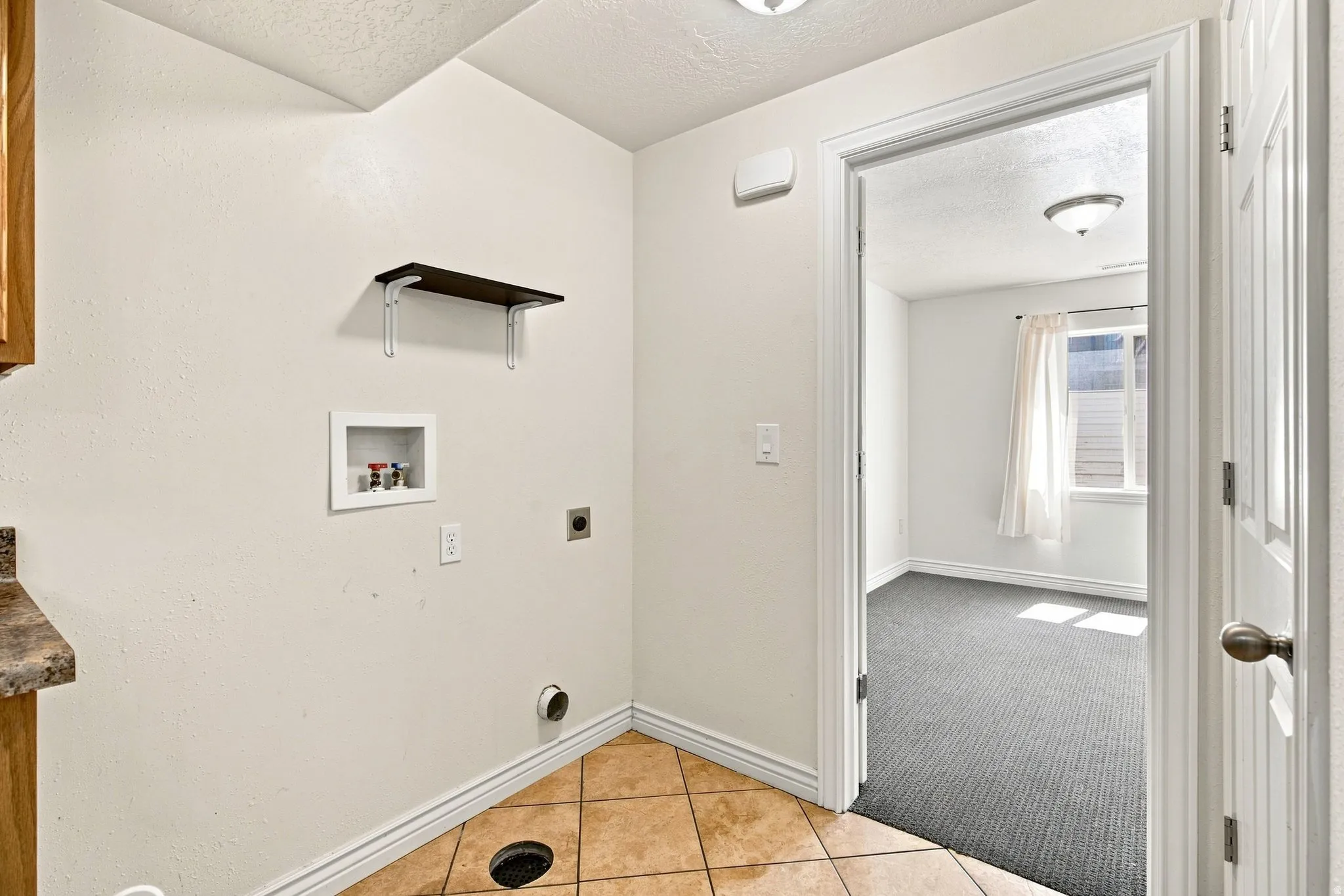 The basement apartment washer and dryer hookups, these are just right of the kitchen counter.