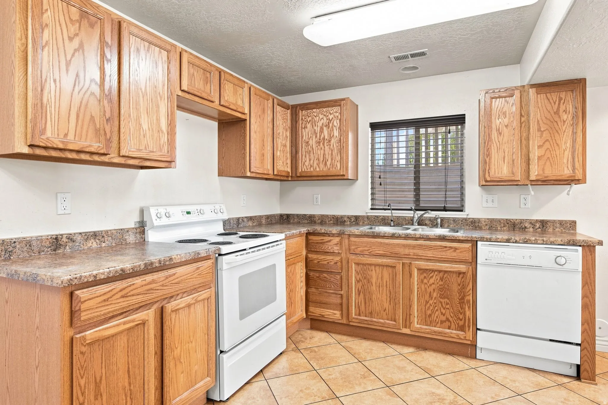 Basement apartment Dining/Kitchen. To the right behind the doors is the utilities for both the furnace and Water heater.