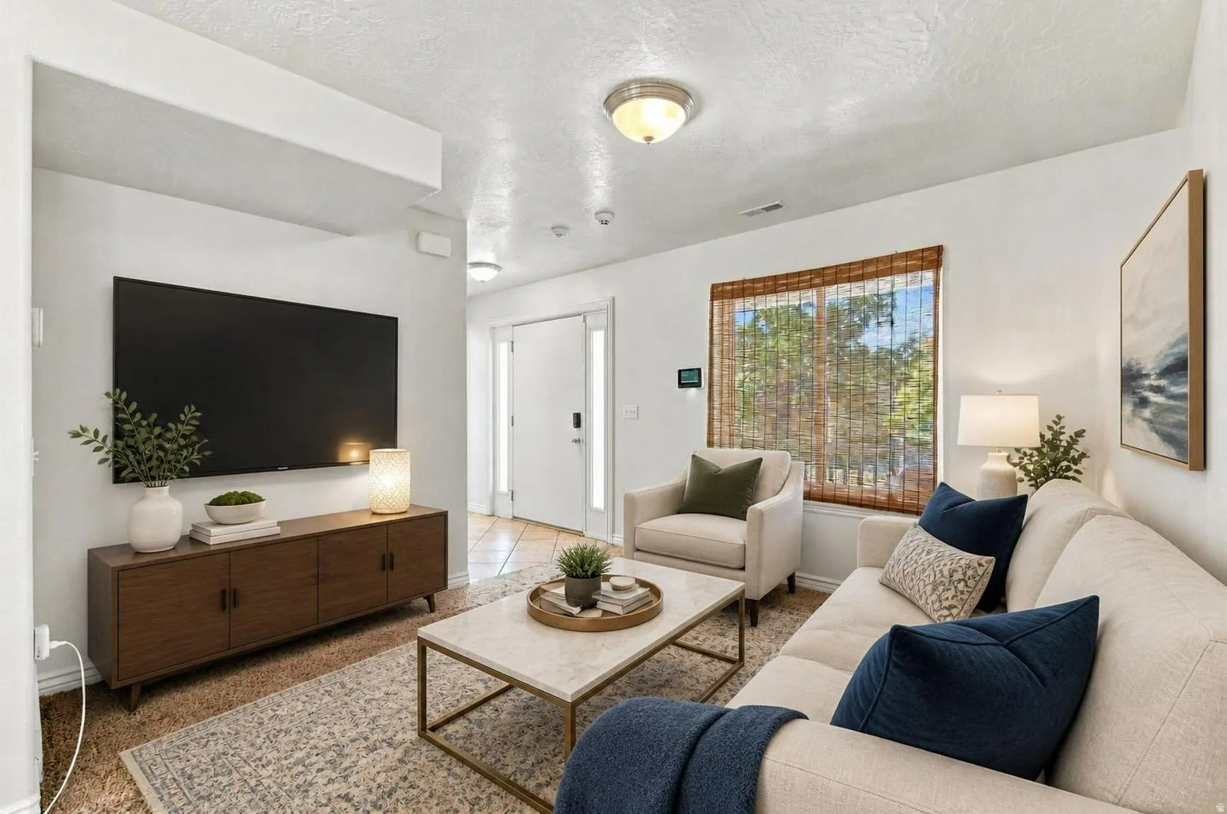 Main floor living room to the left of the entry. This room has been virtually staged.