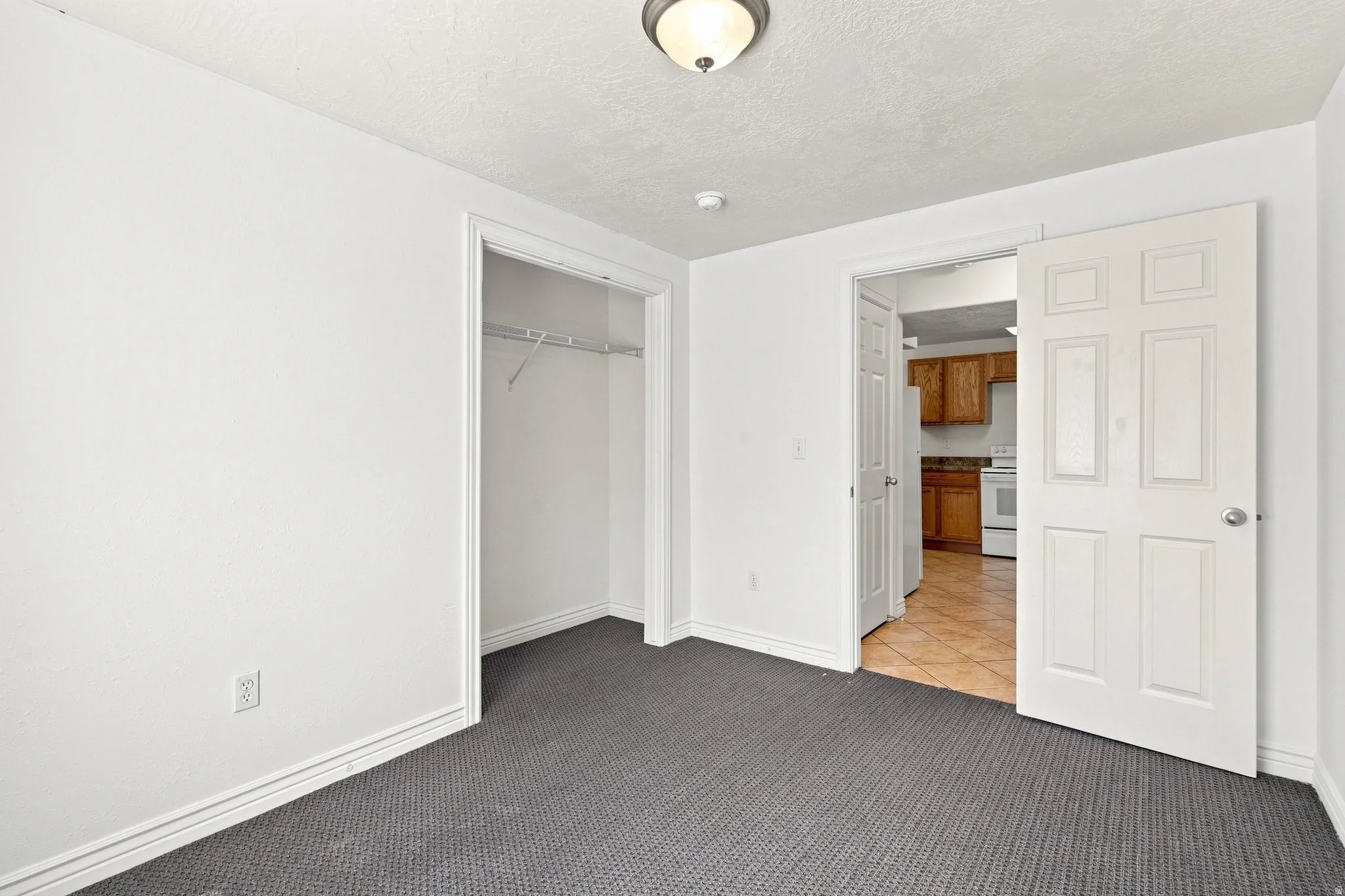 This is one of the two basement apartment bedrooms. This bedroom is behind the stairs to the right of the laundry room.