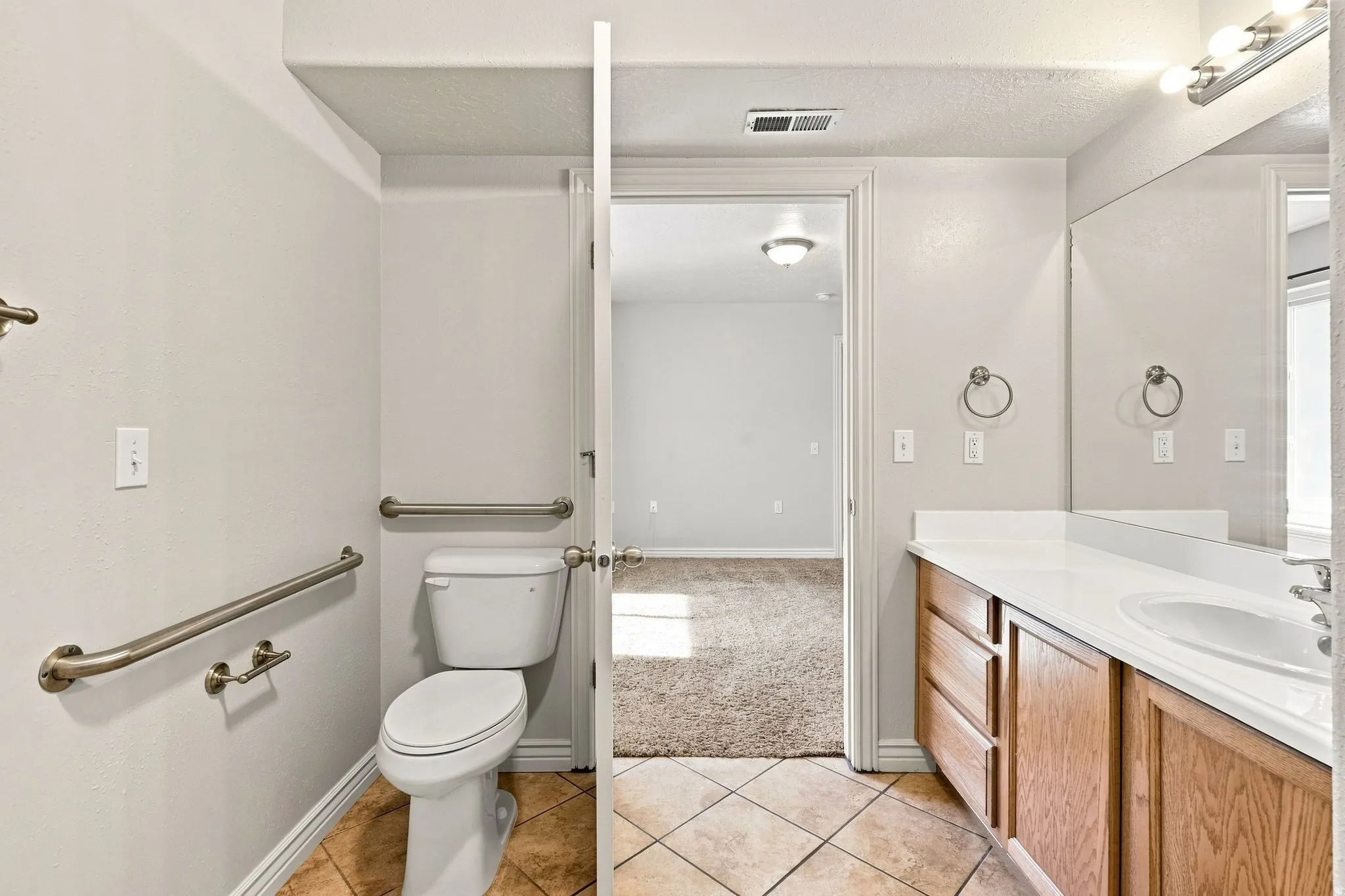 walk-in master shower, vanity and open counter. Handicap accessible grab bars if needed.