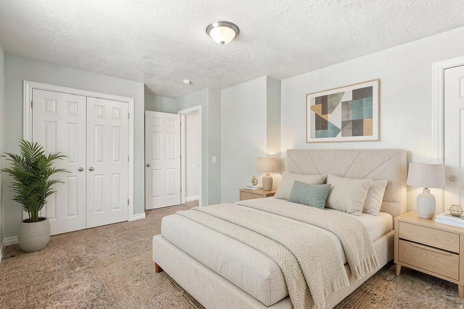 This is one of two basement apartment bedrooms. This bedroom features two large closet's. This picture has been virtually staged.