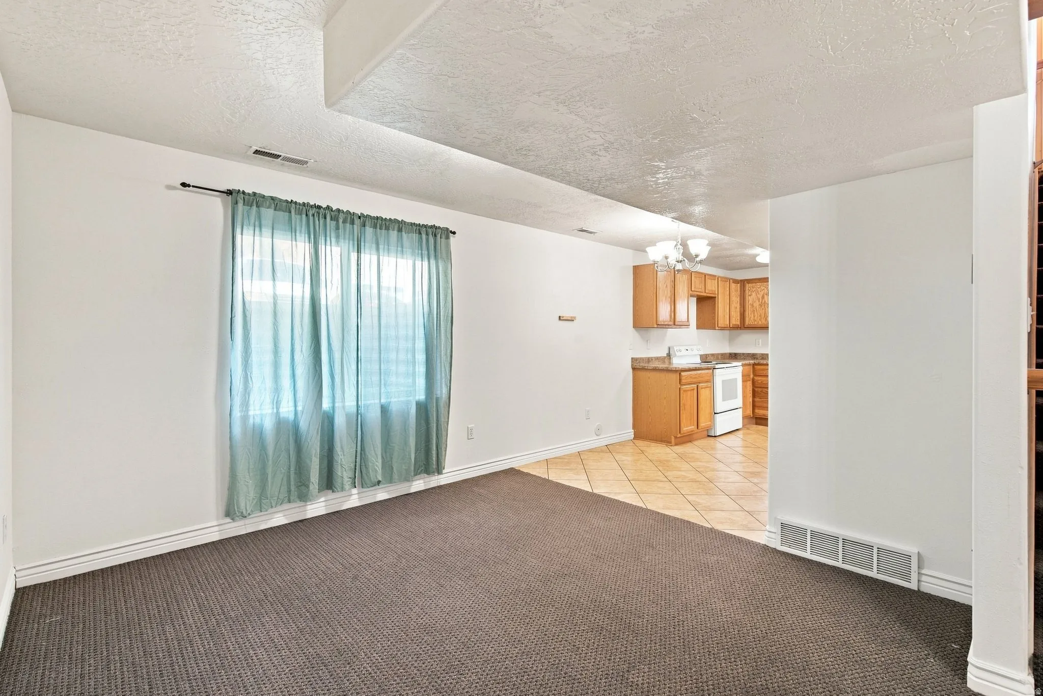 This basement apartment living room provides great space that mirrors the main-level floor plan.